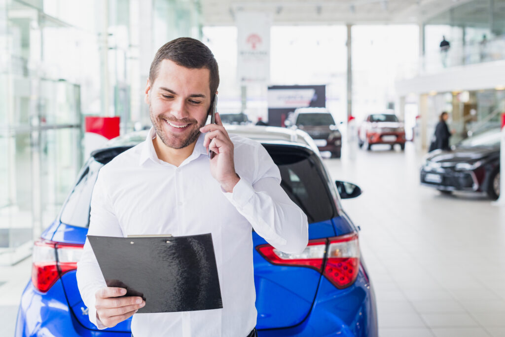 portrait-salesman-car-dealership